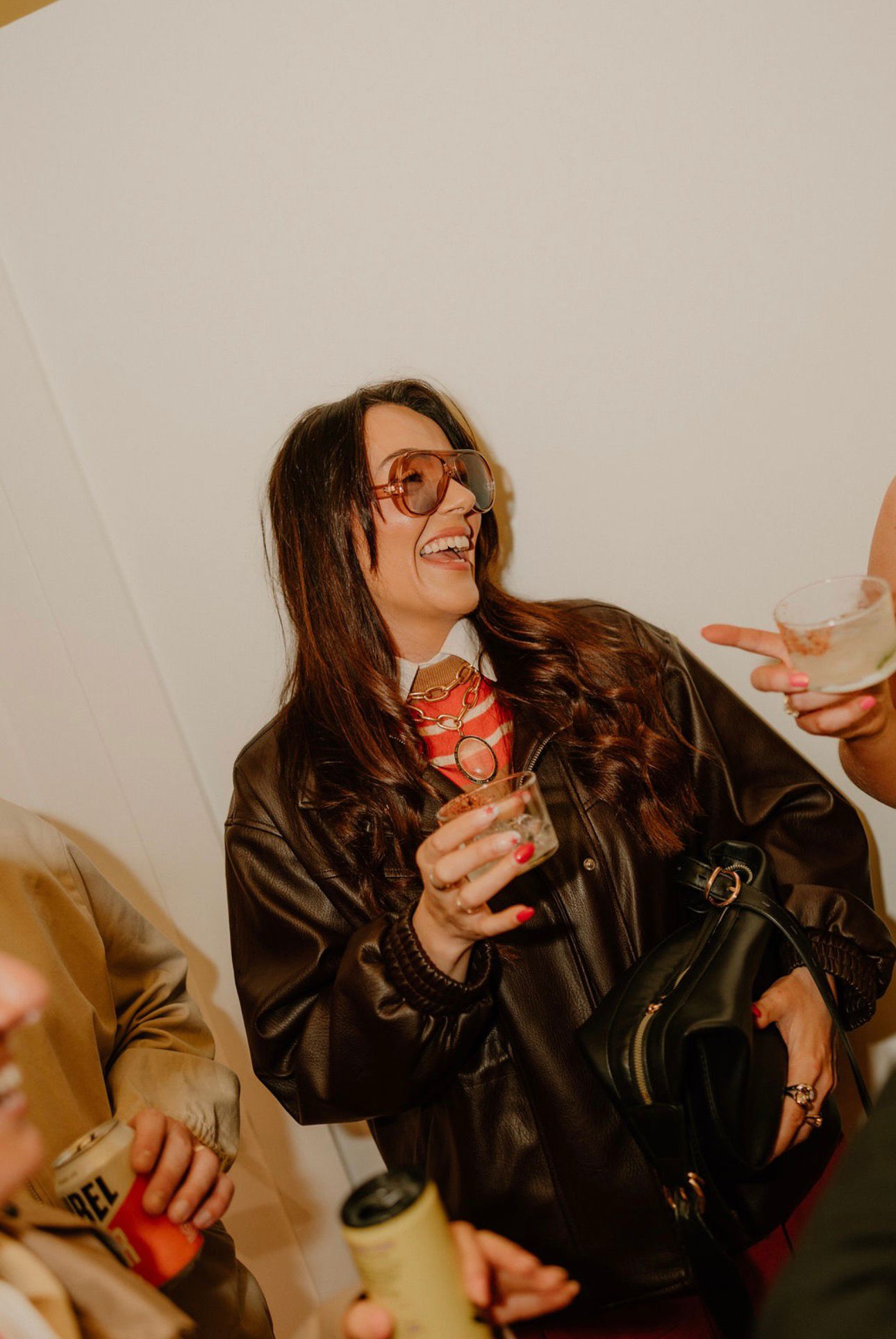 Guest laughing at the Combined. launch party